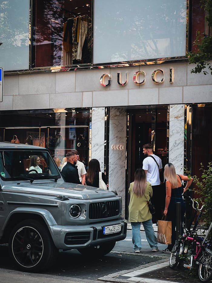 About Shoppers outside Gucci store in Frankfurt am Main, showcasing urban luxury and sophisticated style.